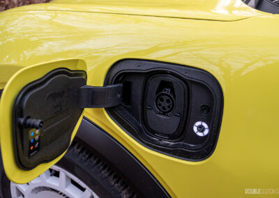Close-up showing the charge port in a 2025 Ford Mustang Mach-E Rally