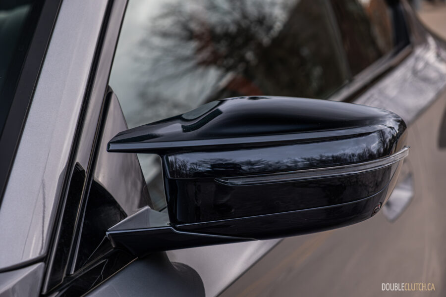 2025 BMW M240i xDrive side-view mirror close-up