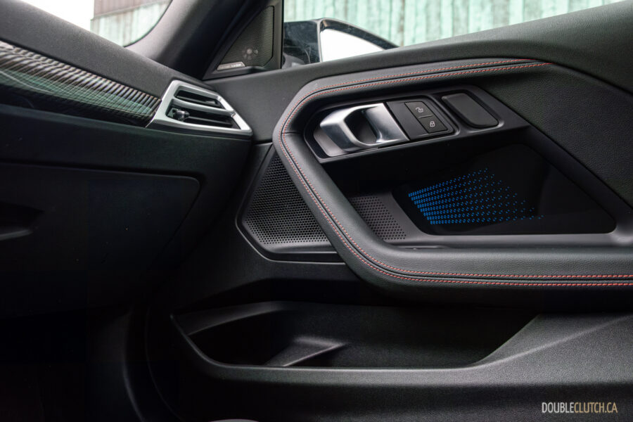2025 BMW M240i xDrive interior passenger-side door panel view
