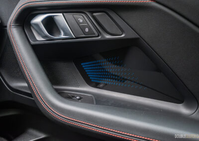 2025 BMW M240i xDrive interior passenger-side door panel view