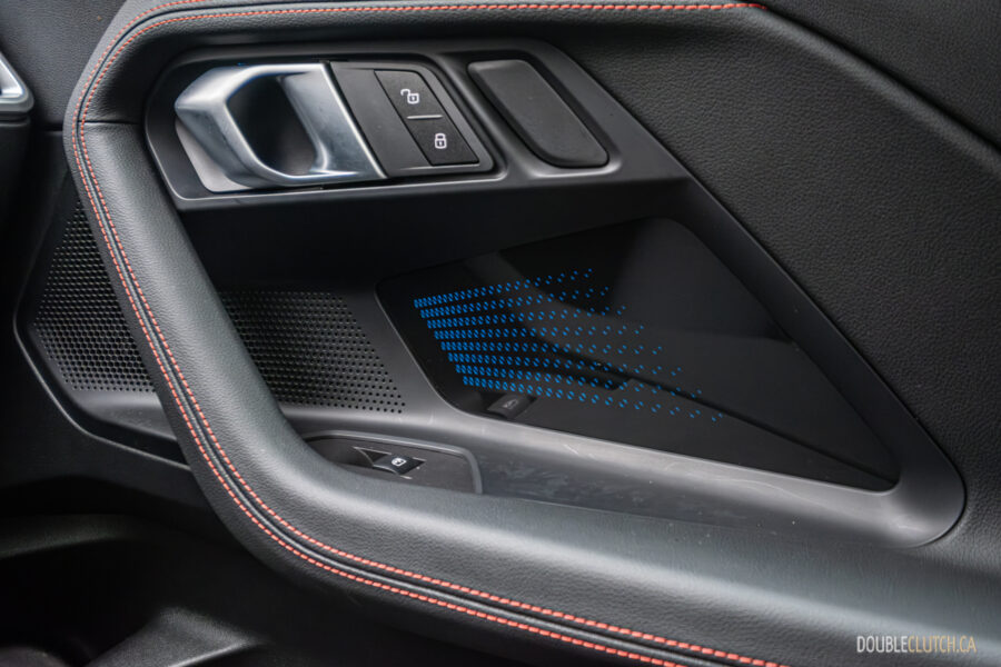 2025 BMW M240i xDrive interior passenger-side door panel view