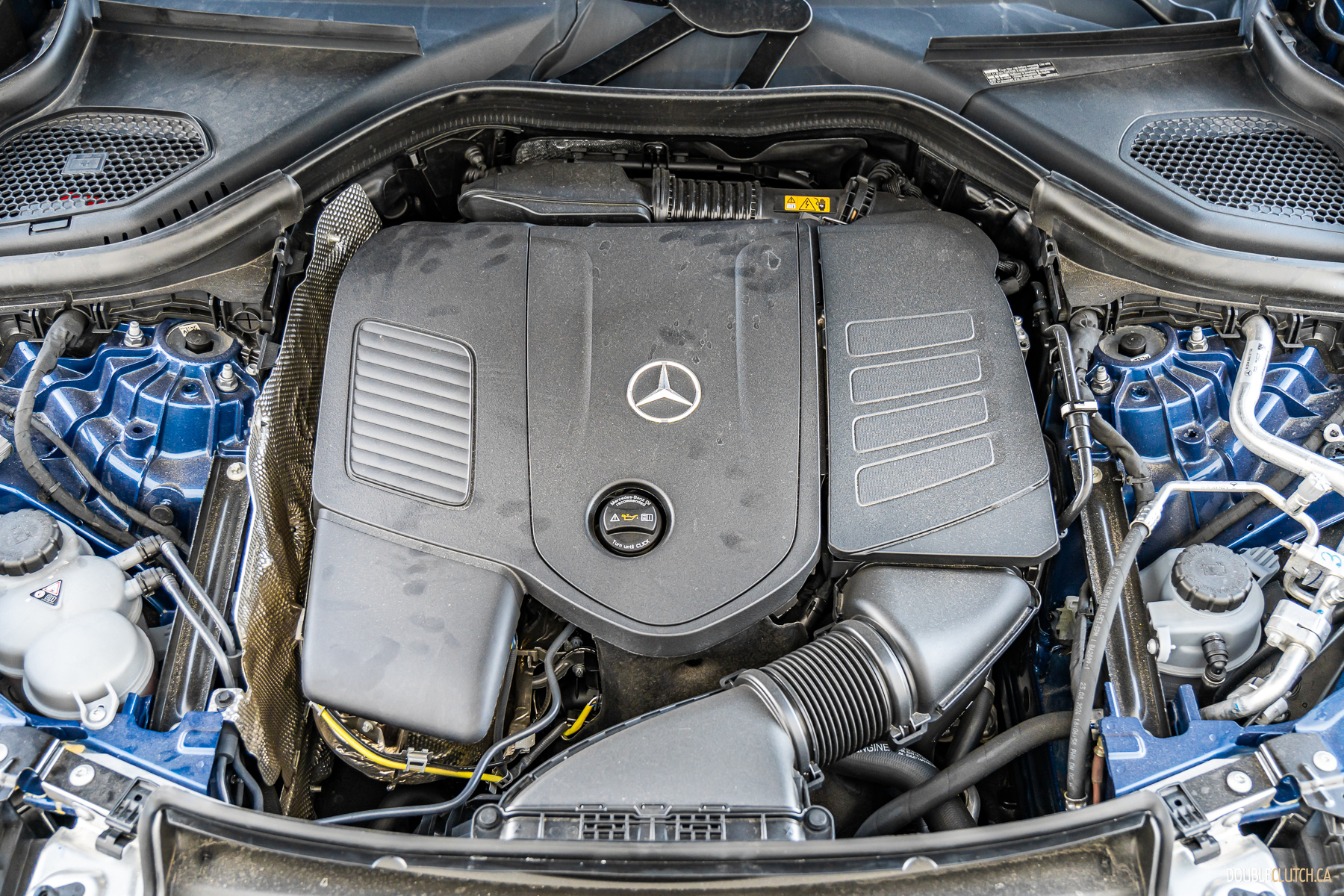 Under-hood view of the turbocharged four-cylinder engine in a 2025 Mercedes-Benz GLC 350e