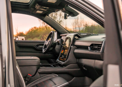 Interior view of the dash design and layout in a 2025 GMC Yukon AT4 Ultimate