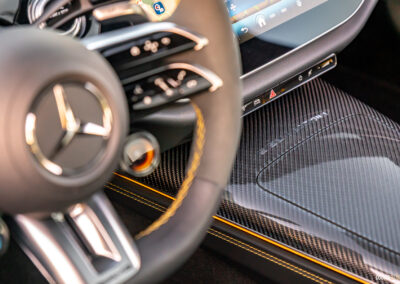 2025 Mercedes-AMG E 53 steering wheel and centre console close-up