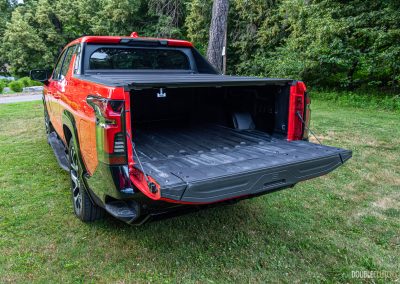 2025 Chevrolet Silverado EV RST rear quarter view with tailgate ajar