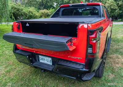 2025 Chevrolet Silverado EV RST rear quarter view with tailgate partially ajar