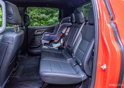 2025 Chevrolet Silverado EV RST rear seat view with child seat for scale