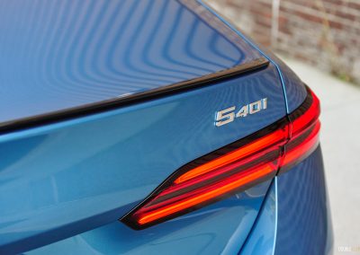 2025 BMW 540i Legacy Edition in Maldives Blue close up model badge