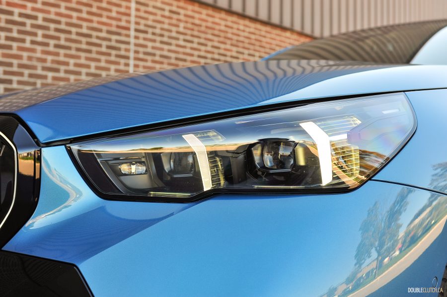 2025 BMW 540i Legacy Edition in Maldives Blue close up headlight
