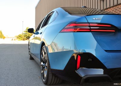 2025 BMW 540i Legacy Edition in Maldives Blue close up rear