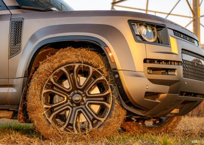 2026 Land Rover Defender OCTA in Petra Copper in mud